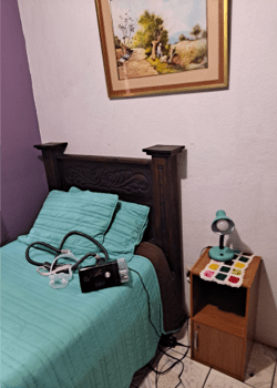 Photo of a bed with medical equipment on top of it