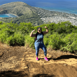 Woman showing muscles after hiking
